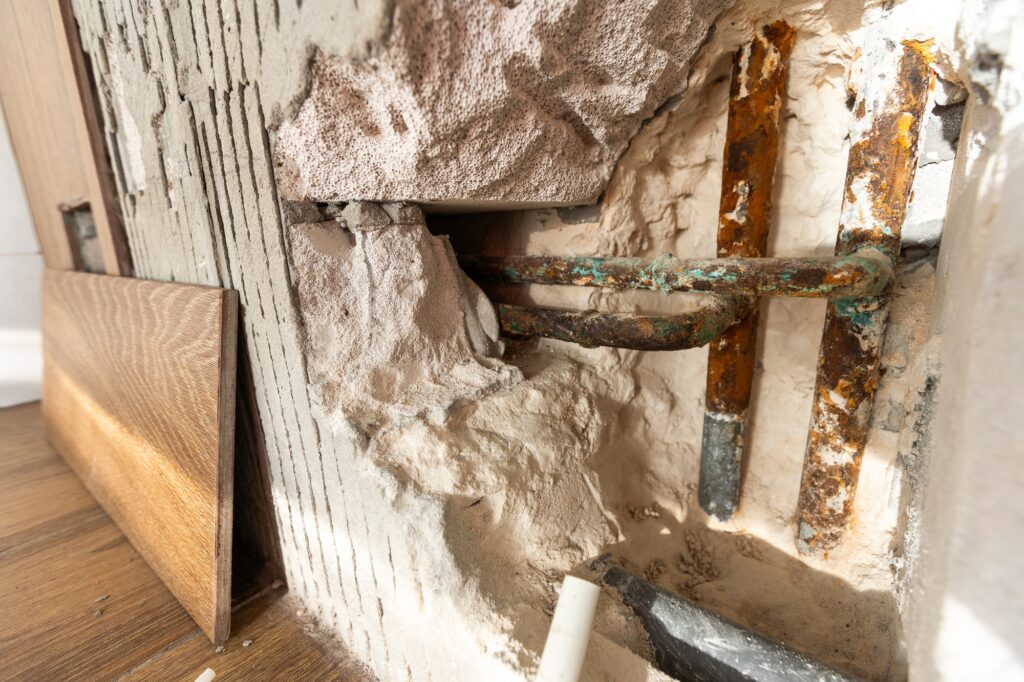 Water damaged wall in an old house. Water damage building interior. wall house broken. Ceiling